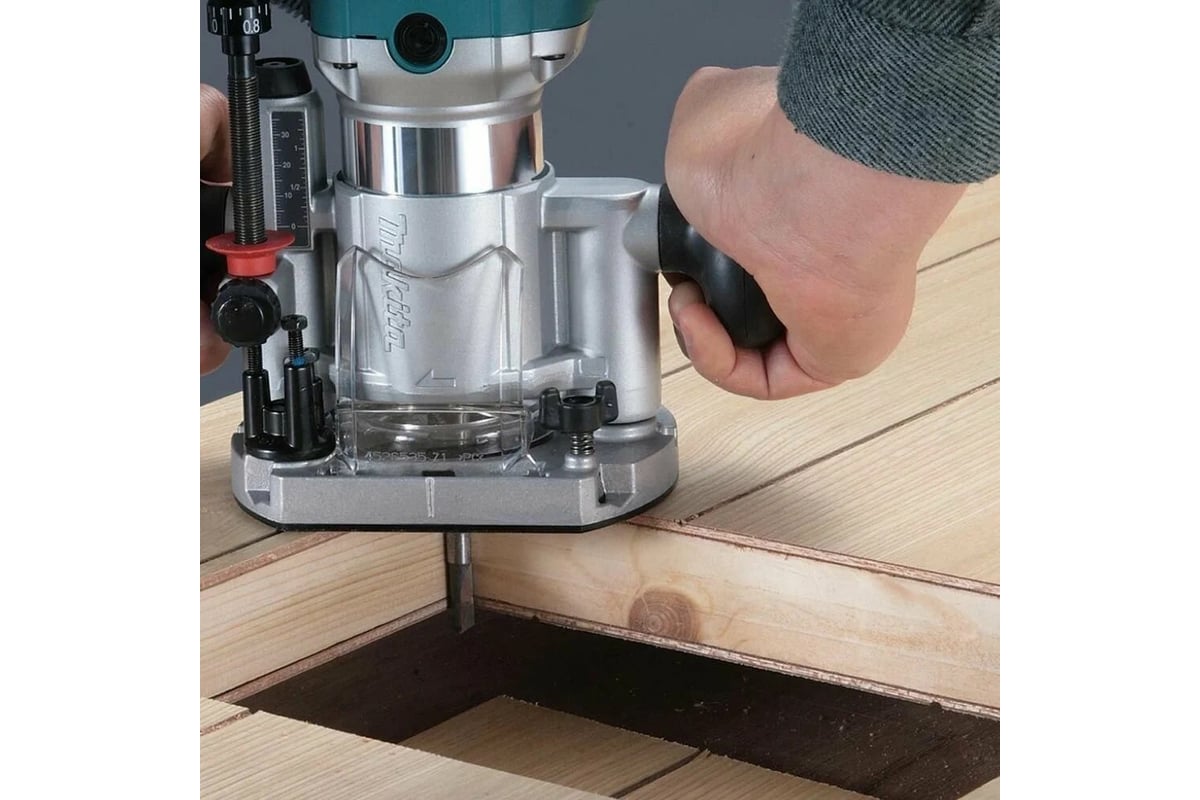 Кромочный фрезер Makita 710 Вт, 10000-34000 об/мин,цанга 6 и 8 мм, копировальная втулка 10 мм, параллельный упор, адаптер пылеудаления, ключи - 2 шт RT0702C